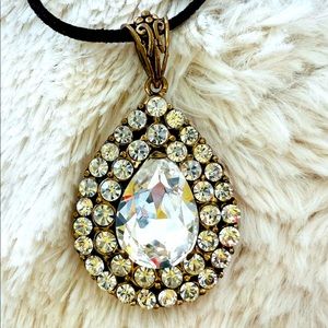 Elegant Rhinestone pendant hanging on black leather Band